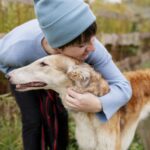 close-up-farmer-spending-time-with-dog-scaled.jpg